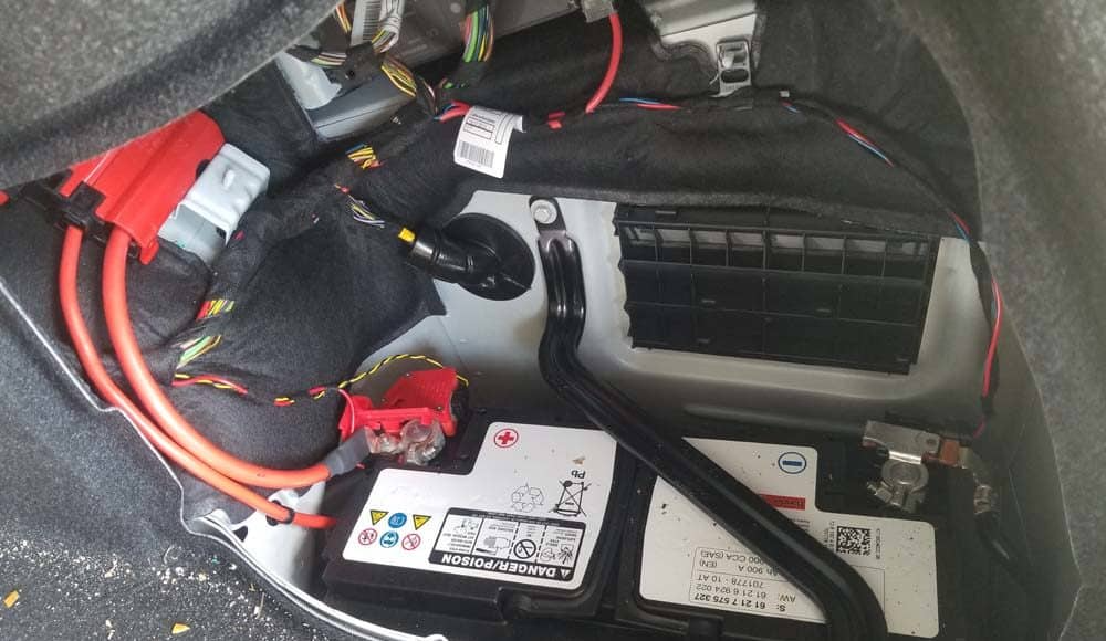 Why in the some model of BMW the battery is on the back